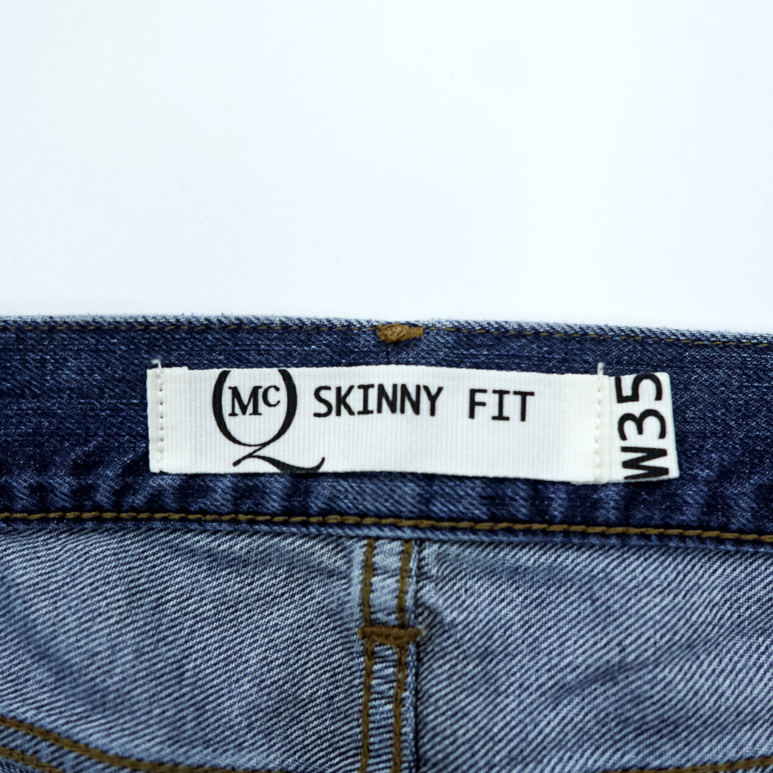 Alexander McQueen Italian-made distressed denim jeans, size L, blue, skinny fit.