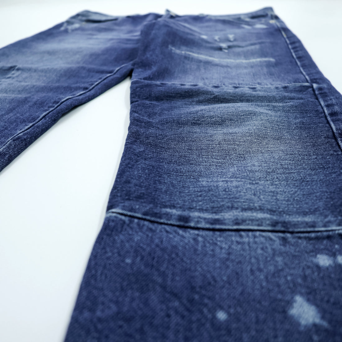 Alexander McQueen Italian-made distressed denim jeans, size L, blue, skinny fit.