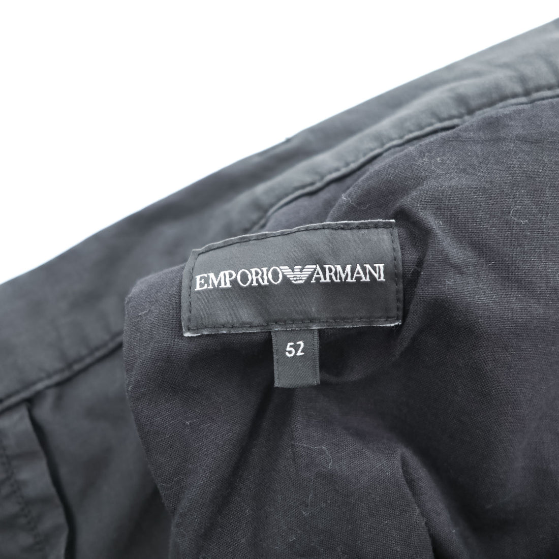 Emporio Armani 7V1PN8 trousers black cotton-blend tapered pleated button-fly side-zip pockets back welt zip EA metal logo cuff 2021 EU52