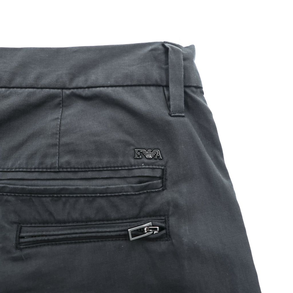 Emporio Armani 7V1PN8 trousers black cotton-blend tapered pleated button-fly side-zip pockets back welt zip EA metal logo cuff 2021 EU52