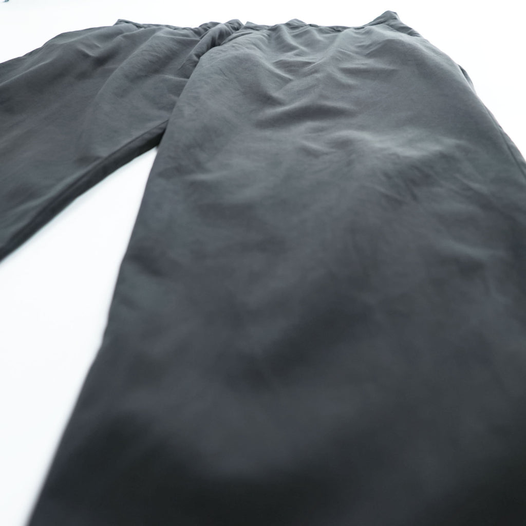 Emporio Armani 7V1PN8 trousers black cotton-blend tapered pleated button-fly side-zip pockets back welt zip EA metal logo cuff 2021 EU52
