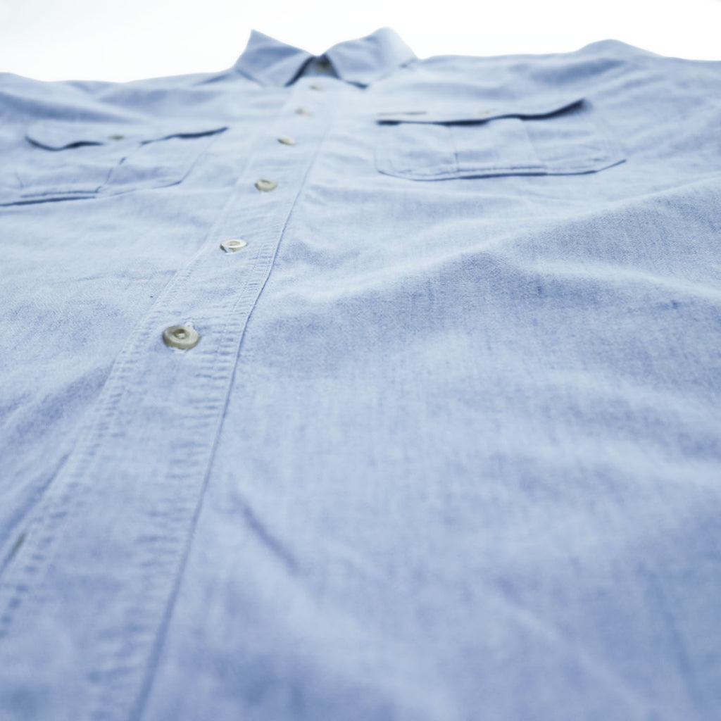 Woolrich 90s USA Made Vintage short sleeve chambray shirt light blue 100% cotton button-down chest flap pockets x2 back box pleat Made in USA XL