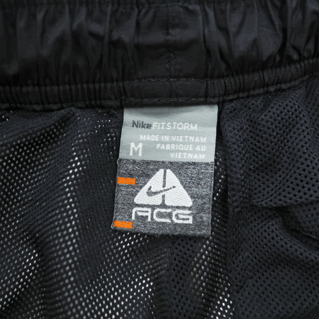 NIKE ACG 00年代 ヴィンテージ トラックパンツ ジャージ M ブラック リップストップ 防水 STORM FIT サイドジップ スリット スナップボタン