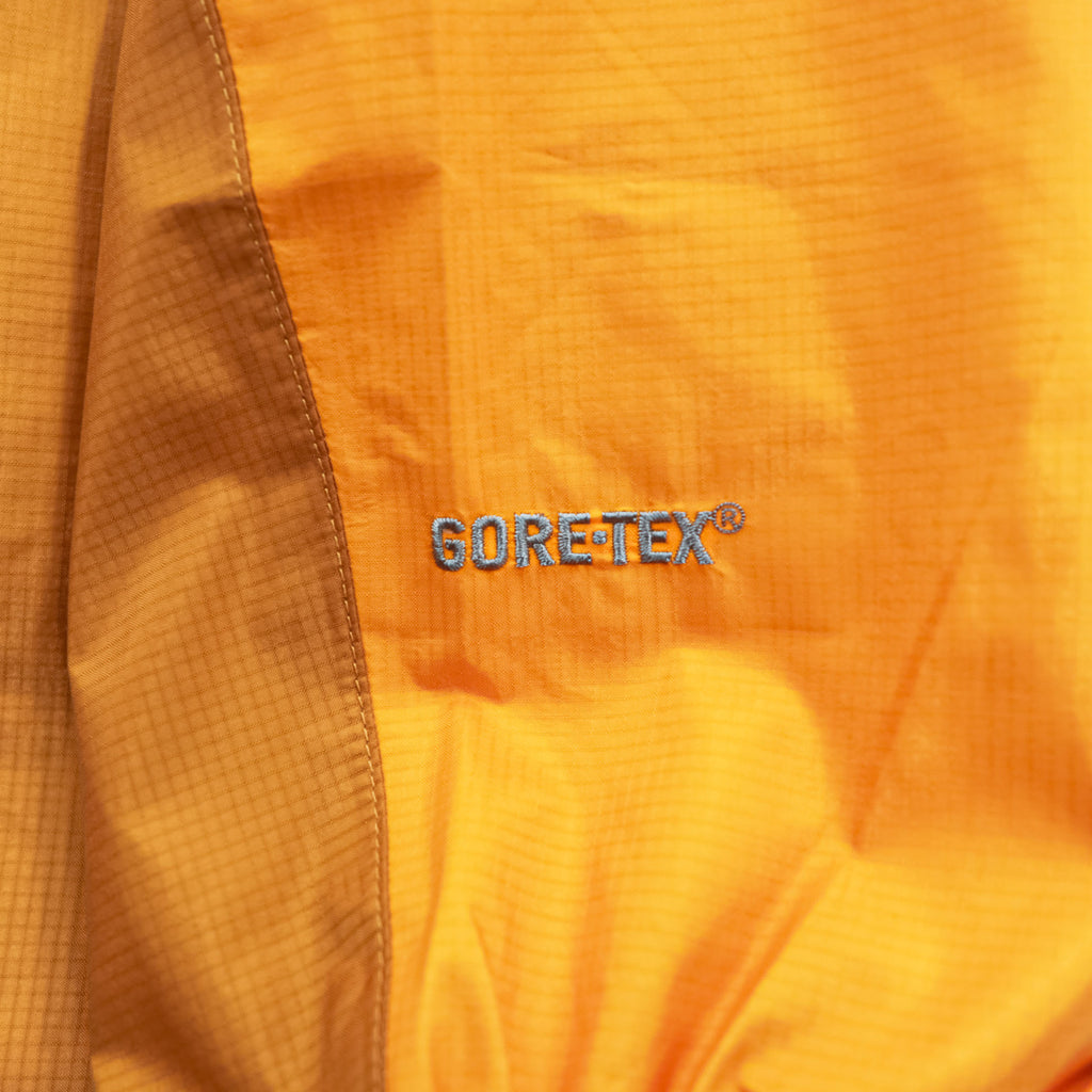 mont-bell ゴアテックス GORE-TEX 防水 マウンテンパーカー シェル レインジャケット L オレンジ ストームクルーザー ドローコード フード収納 1128256