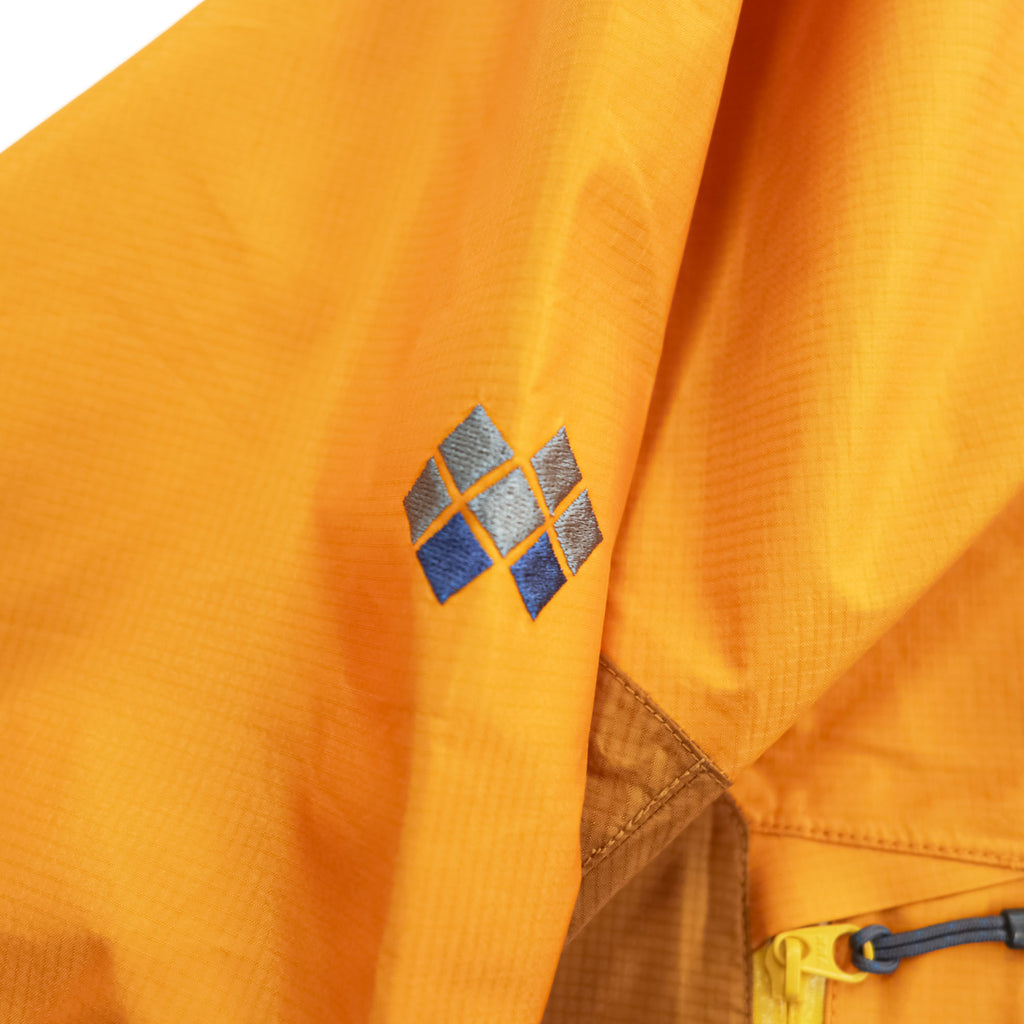 mont-bell ゴアテックス GORE-TEX 防水 マウンテンパーカー シェル レインジャケット L オレンジ ストームクルーザー ドローコード フード収納 1128256