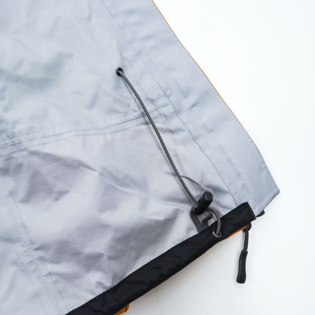 mont-bell ゴアテックス GORE-TEX 防水 マウンテンパーカー シェル レインジャケット L オレンジ ストームクルーザー ドローコード フード収納 1128256