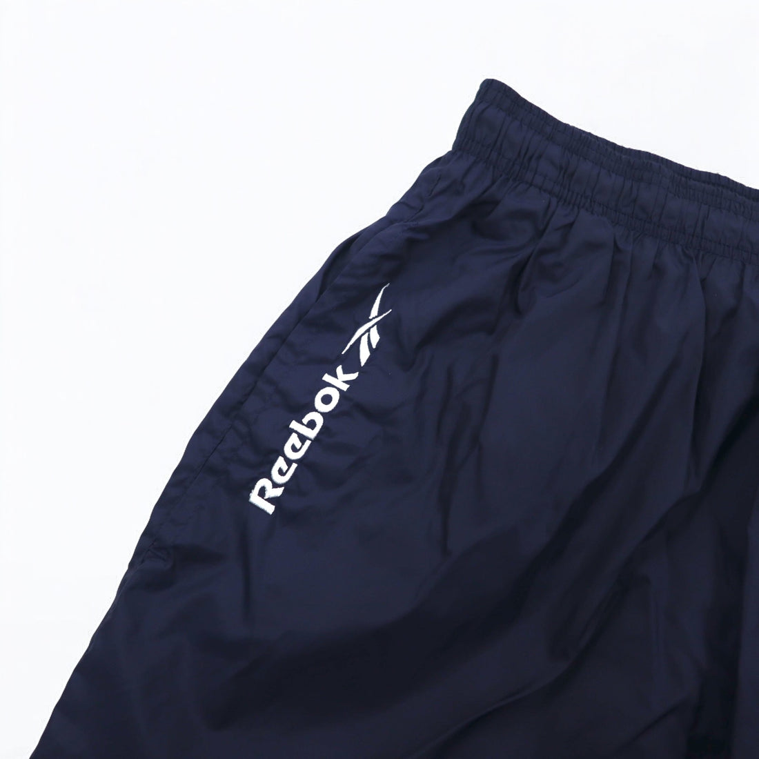 Reebok 90s nylon track pants, jersey, L, navy, vector logo embroidery, slit, zip hem