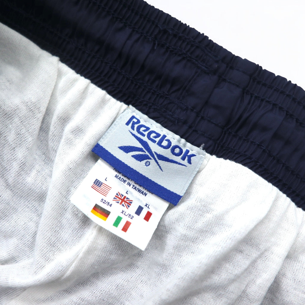 Reebok 90s nylon track pants, jersey, L, navy, vector logo embroidery, slit, zip hem
